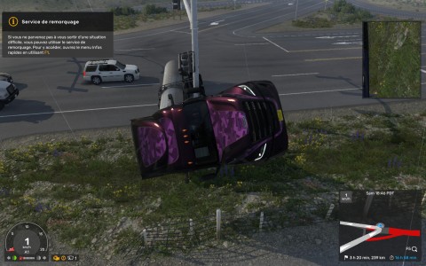 Capture d'écran du jeu American Truck Simulator montrant un camion américain semi-remorque couché sur le côté droit, vue de face, à une intersection.